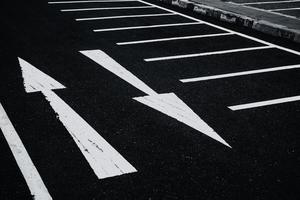 2 Ways two directions arrows paint on asphalt road. Conflicts Confusion concept. photo