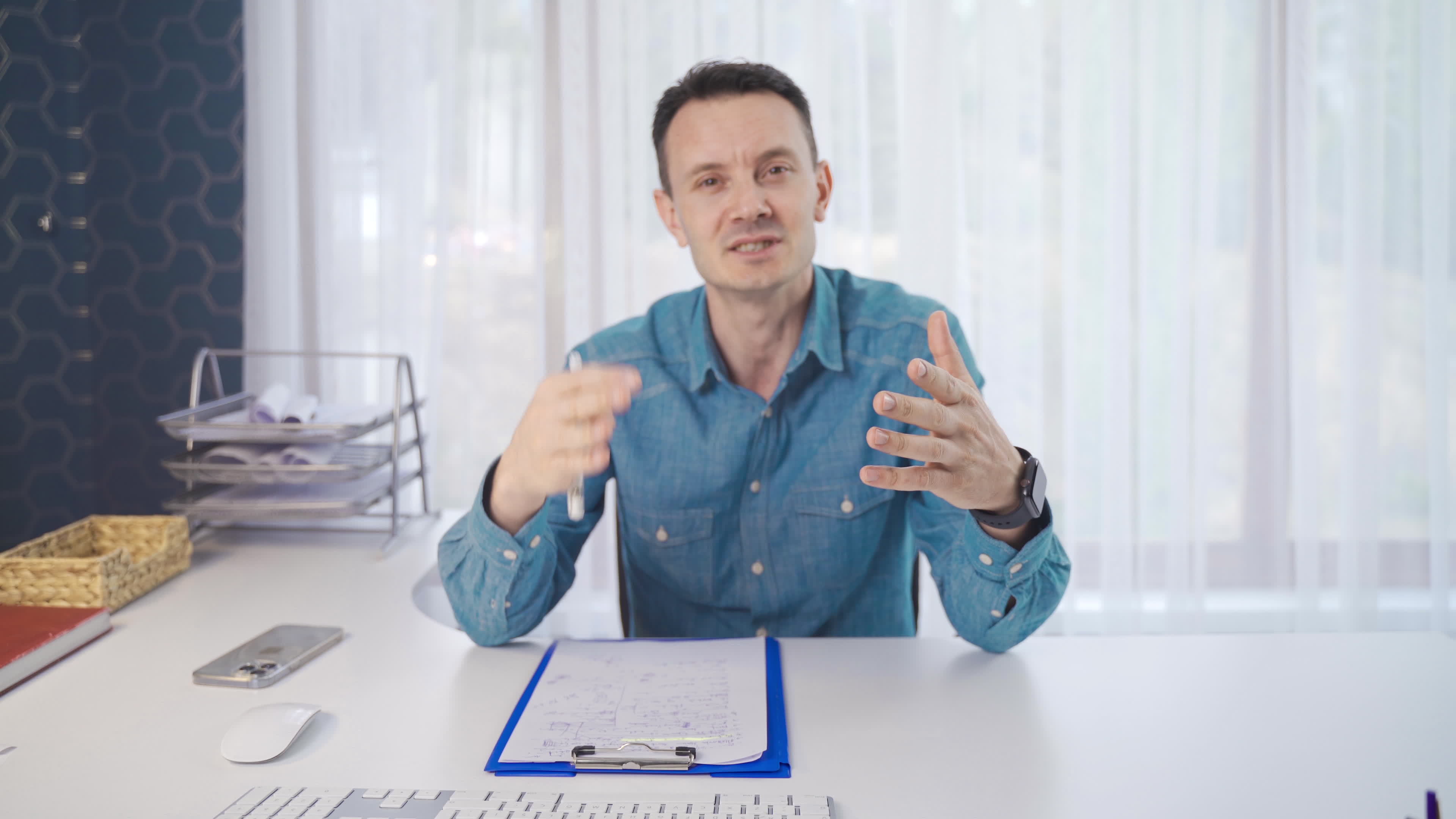 Man giving speech is looking at camera. Man looking at camera giving