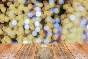 Empty wood table top with blur Christmas tree with bokeh light background photo