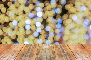 Empty wood table top with blur Christmas tree with bokeh light background photo