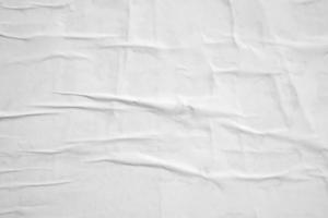 white crumpled and creased paper poster texture background photo