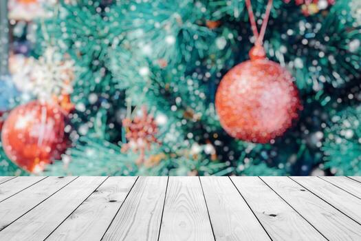 Empty wood table top with blur Christmas tree with bokeh light background photo