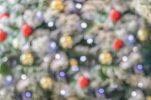 Abstract blurred christmas tree with bokeh light background photo