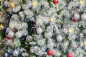 Abstract blurred christmas tree with bokeh light background photo