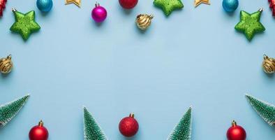 Christmas new year background pine tree ball bauble on blue pastel background photo