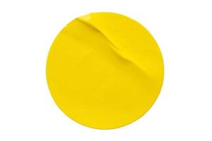 Yellow round paper sticker label isolated on white background photo