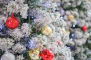 Abstract blurred christmas tree with bokeh light background photo