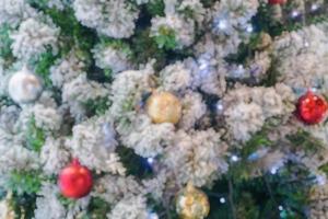 Abstract blurred christmas tree with bokeh light background photo