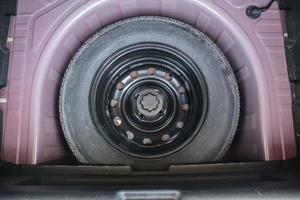 spare tire in the modern compact car photo