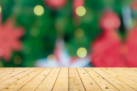 Empty wood table top with blur Christmas tree with bokeh light background photo