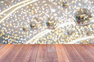 Empty wood table top with blur Christmas tree with bokeh light background photo