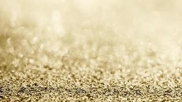 Abstract gold glitter sparkle blurred with bokeh background photo