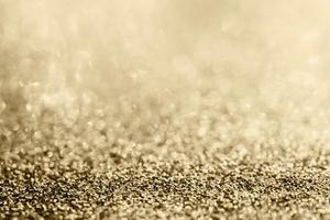 Abstract gold glitter sparkle blurred with bokeh background photo