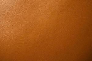 Brown leather texture background close up photo