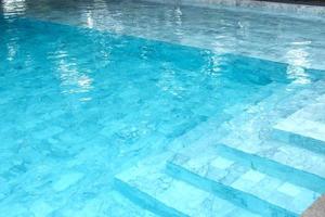 Blue ripple water in swimming pool. photo