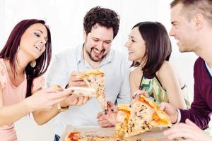 Cheerful Friends Eating Pizza photo