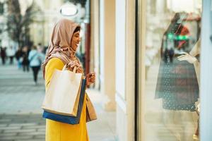 Black Muslim Woman With Hijab In The Shopping photo