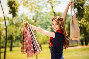 Happy girl with shopping bags photo