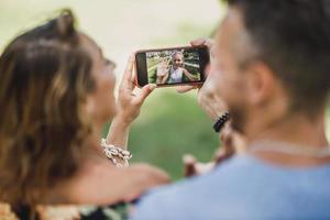 Parents Making Video Call With Daughter Over A Smart Phone photo