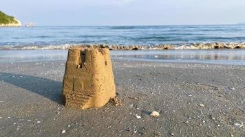 A sand castle on the beach photo