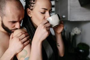 man and woman in the kitchen photo