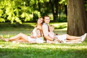 Happy Family Resting In The Park photo