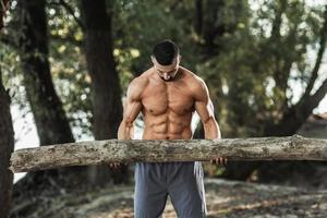 Man Doing Training Outdoor With Timber photo