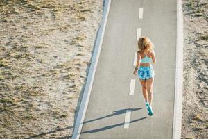 Middle Age Sportswoman Running Outdoor photo