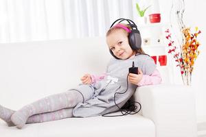 Little Girl Listening Music photo