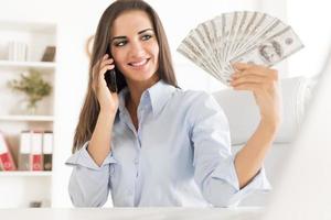 Young Businesswoman With Dollars photo