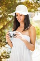 Woman with retro photo camera