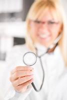 Female Doctor Holding Stethoscope photo