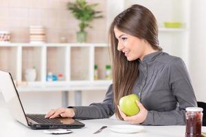 Businesswoman with apple photo