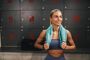 Woman Relaxing In Gym's Locker Room Before Training photo