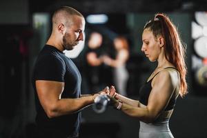 Woman Exercising With Fitness Instructor photo