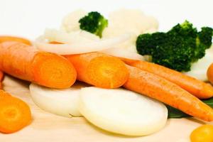 Chopped vegetables on cutting board photo