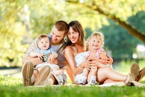 Happy Family Enjoying In The Park photo