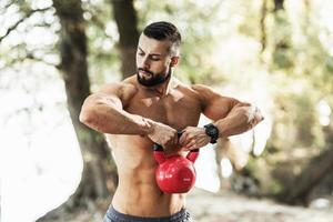 Man Outdoor Exercise With Weights photo