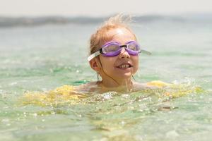 Little girl swimming photo