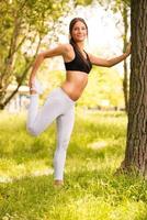 Cute girl exercise in the park photo