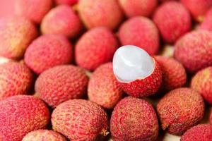 Lychee slice peeled texture background top view - Fresh lychee harvest in basket from tree tropical fruit summer in Thailand photo