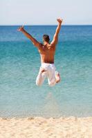 Happy Man Jumping Into Water photo