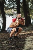 Man Outdoor Exercise With Weights photo