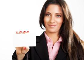 Businesswoman holding card photo