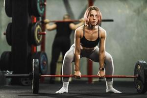 Muscular Woman Doing Back Training photo