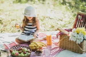 Little Girl Enjoying Day In Nature On Picnic photo