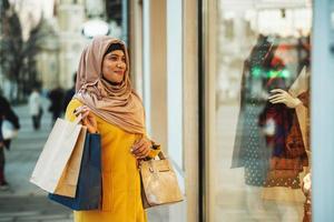Black Muslim Woman With Hijab In The Shopping photo