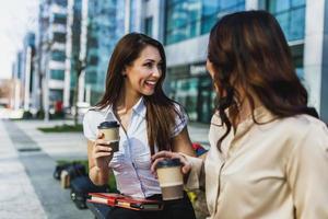 Two Business Women Talking While Having Coffee Break Outdoor photo