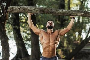 Man Doing Training Outdoor With Timber photo