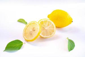 Creative layout made of lemon and leaves. Flat lay. Food concept. Lemon on white background photo